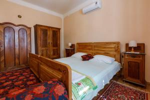 Postel nebo postele na pokoji v ubytování Villa Drago + 37 fotografií
