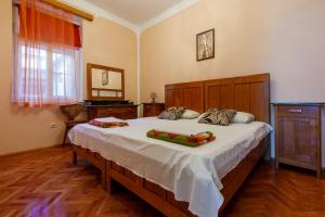 Postel nebo postele na pokoji v ubytování Villa Drago