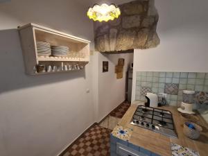 Kuchyň nebo kuchyňský kout v ubytování Agorà Sant’anna Apartment