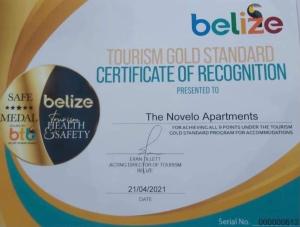 a package ofiction gold standard certificate of recognition at The Novelo in Caye Caulker