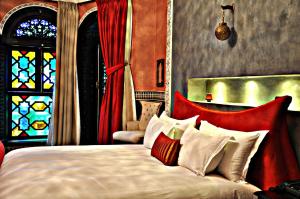Postel nebo postele na pokoji v ubytování Palais Ommeyad Suites & Spa