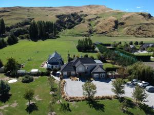 an aerial view of a house on a hill at Queenstown Country Lodge in Queenstown