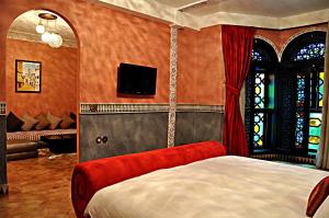 TV a/nebo společenská místnost v ubytování Palais Ommeyad Suites & Spa