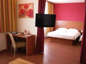 Säng eller sängar i ett rum på City Hotel Budapest