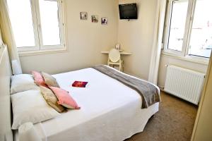 Postel nebo postele na pokoji v ubytování Hôtel Oxo
