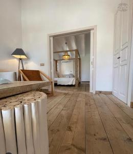 A bed or beds in a room at Finca Hotel Rural Es Turó