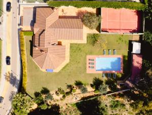 an overhead view of a house with a swimming pool at Villamaresme in Sant Andreu de Llavaneres