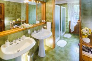 a bathroom with a sink and a mirror at Convento di San Francesco Mondaino in Mondaino