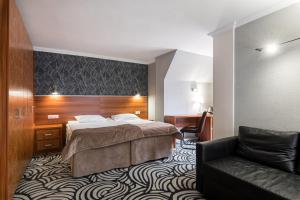 Кровать или кровати в номере Отель Матисов Домик у Новой Голландии