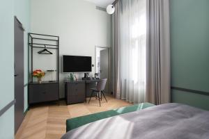 Postel nebo postele na pokoji v ubytování Alice Hotel