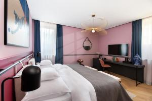 Postel nebo postele na pokoji v ubytování Alice Hotel