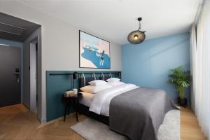 Postel nebo postele na pokoji v ubytování Alice Hotel