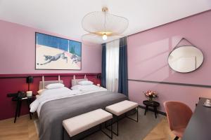 Postel nebo postele na pokoji v ubytování Alice Hotel