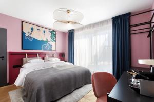 Postel nebo postele na pokoji v ubytování Alice Hotel