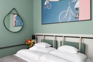 Postel nebo postele na pokoji v ubytování Alice Hotel