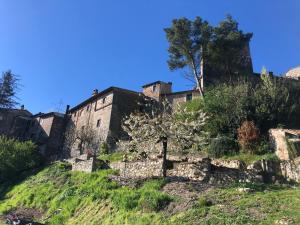 an old castle on top of a hill at Lemon Tree Boutique Guest House in Todi