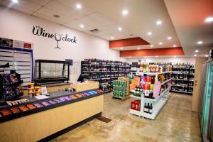 a wine store with a wine rack and a wine clerk at Wavecrest Village & Tourist Park in Hopetoun