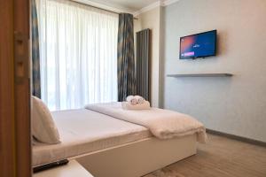 En eller flere senge i et værelse på MoonStar Apartment - Spa n Pools beach Resort + 21 billeder