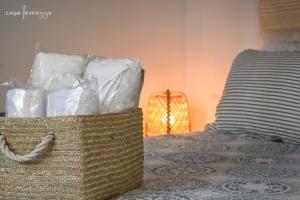 a basket of towels sitting on top of a bed at Casa terrazzo in Paradeísion