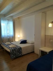 Voodi või voodid majutusasutuse B&B Aria d'Argento & Relax Home toas