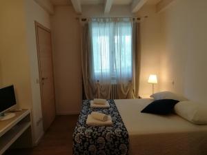 Voodi või voodid majutusasutuse B&B Aria d'Argento & Relax Home toas