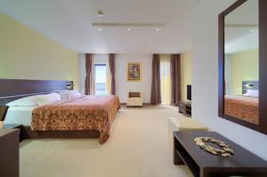 Posteľ alebo postele v izbe v ubytovaní Hotel Marina