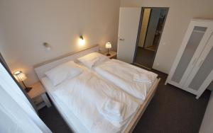 Postel nebo postele na pokoji v ubytování WannerHus Hotel