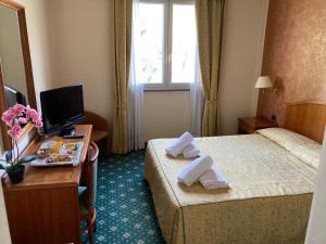 Кровать или кровати в номере Hotel Visconti
