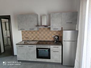 Η κουζίνα ή μικρή κουζίνα στο Roby's house, vivi la vacanza in relax (2L)