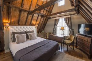 Postel nebo postele na pokoji v ubytování Boutique Hotel Huys van Leyden + 37 fotografií