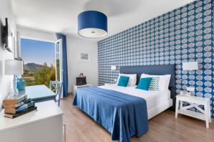 מיטה או מיטות בחדר ב-Hotel Vista di Capri