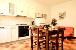 a kitchen with a table with chairs and a stove at Agriturismo Montioni in Sovicille +90 photos