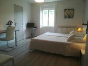 Postel nebo postele na pokoji v ubytování Le Relais de Ceilhes