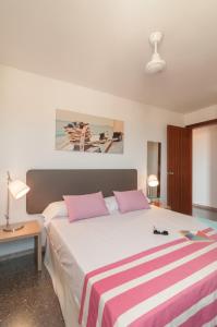Кровать или кровати в номере Pierre & Vacances Comarruga