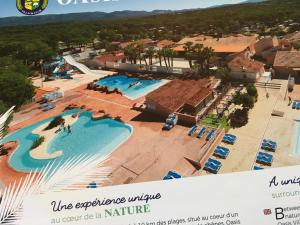 an overhead view of a pool at a resort at Oasis village in Puget-sur-Argens