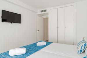 Posteľ alebo postele v izbe v ubytovaní Serenity Apartments