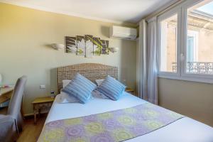 Postel nebo postele na pokoji v ubytování Hotel Sainte Anne - Apt