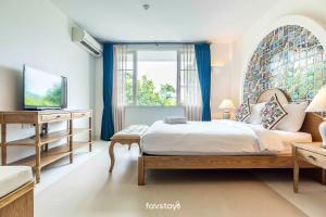 Katil atau katil-katil dalam bilik di Chelona Hua Hin by Favstay +26 gambar