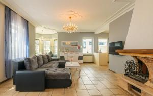 a living room with a couch and a kitchen at Hotel Koch Schilt in Irrel
