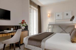 Voodi või voodid majutusasutuse Hotel Ambasciatori toas