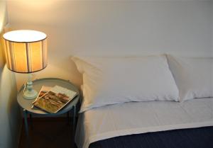 A bed or beds in a room at Corte Colori