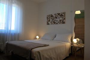 A bed or beds in a room at Corte Colori