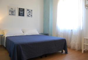 A bed or beds in a room at Corte Colori