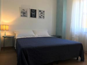 A bed or beds in a room at Corte Colori