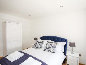 Postel nebo postele na pokoji v ubytování Mynydd Mwyn