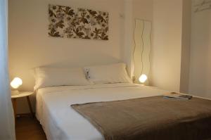 A bed or beds in a room at Corte Colori