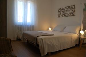 A bed or beds in a room at Corte Colori