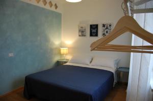 A bed or beds in a room at Corte Colori