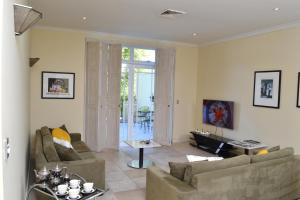 a living room with two couches and a table at The Traill in Margaret River Town