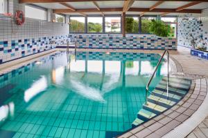 Bazén v ubytování Hotel Juan de la Cosa nebo v jeho okolí